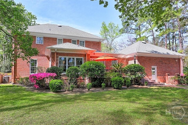 320 Wedgefield Xing, Savannah, GA 31405 - rear view of property featuring brick siding and a yard