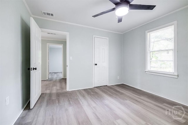 133 Parsons Ave, Pooler, GA 31322 - unfurnished bedroom with wood finished floors, crown molding, baseboards, and a ceiling fan