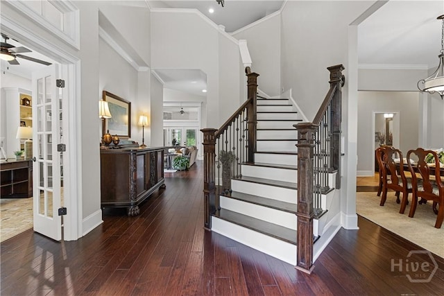 325 Shadow Moss Cir, Richmond Hill, GA 31324 - entryway with ceiling fan, wood-type flooring, ornamental molding, stairway, and french doors
