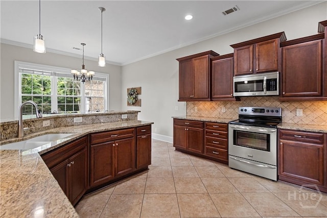 325 Shadow Moss Cir, Richmond Hill, GA 31324 - kitchen featuring appliances with stainless steel finishes, a chandelier, backsplash, light tile patterned flooring, and ornamental molding