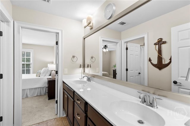 325 Shadow Moss Cir, Richmond Hill, GA 31324 - ensuite bathroom featuring double vanity, tile patterned flooring, and ceiling fan