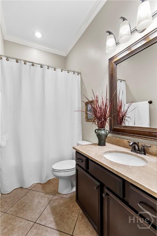 325 Shadow Moss Cir, Richmond Hill, GA 31324 - bathroom with ornamental molding, vanity, and tile patterned flooring