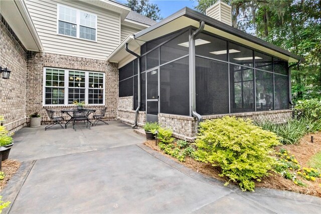 325 Shadow Moss Cir, Richmond Hill, GA 31324 - view of patio with a sunroom