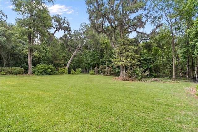 325 Shadow Moss Cir, Richmond Hill, GA 31324 - view of green lawn featuring a forest view