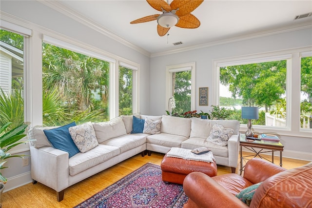 27 Mainsail Xing, Savannah, GA 31411 - living room with ceiling fan, light wood-style flooring, ornamental molding, and baseboards