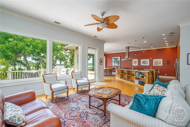 27 Mainsail Xing, Savannah, GA 31411 - living room with ornamental molding, baseboards, light wood-style floors, ceiling fan, and recessed lighting