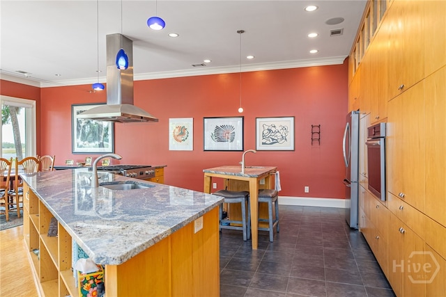 27 Mainsail Xing, Savannah, GA 31411 - kitchen with a large island with sink, crown molding, appliances with stainless steel finishes, recessed lighting, and light stone counters