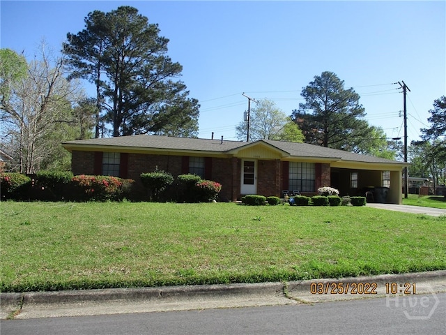 1606 Rosemary St, Savannah, GA 31415 - ranch-style home featuring a front yard, driveway, an attached carport, and brick siding