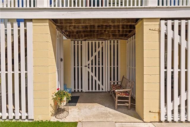 130 Lewis Ave, Tybee Island, GA 31328 - doorway to property featuring concrete block siding