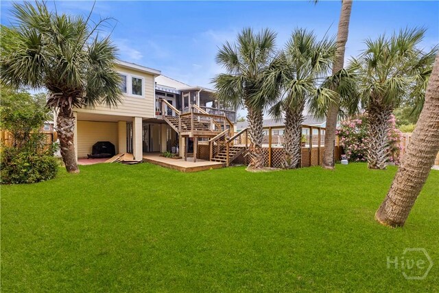 130 Lewis Ave, Tybee Island, GA 31328 - back of house featuring stairway, a deck, a lawn, and a carport