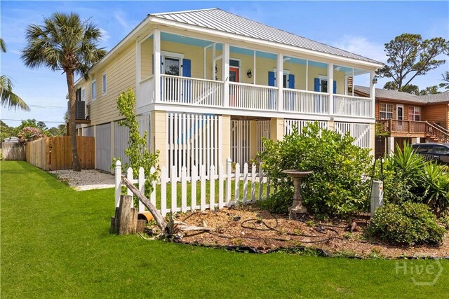 130 Lewis Ave, Tybee Island, GA 31328 - view of front of home with metal roof