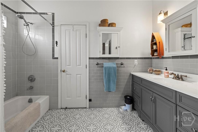 130 Lewis Ave, Tybee Island, GA 31328 - bathroom featuring tile walls, vanity, tile patterned floors, shower / bath combination, and a wainscoted wall