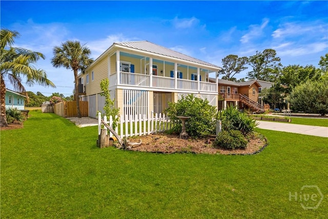 130 Lewis Ave, Tybee Island, GA 31328 - rear view of property with metal roof and driveway