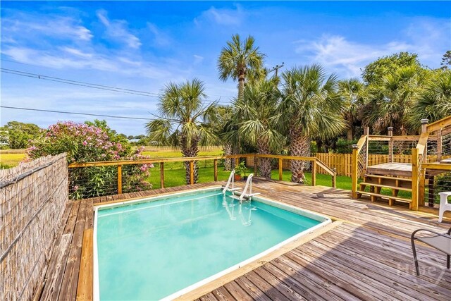 130 Lewis Ave, Tybee Island, GA 31328 - view of swimming pool with a wooden deck