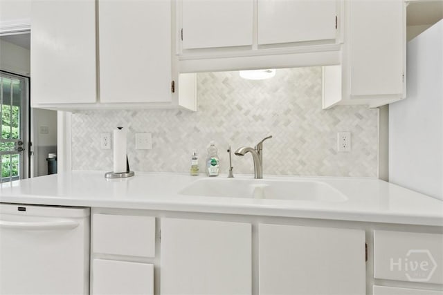 4715 Oakview Dr, Savannah, GA 31405 - kitchen featuring dishwasher, light countertops, white cabinets, a sink, and backsplash