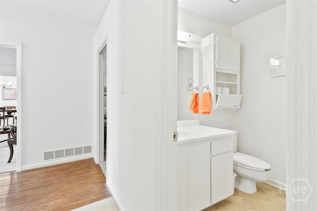 4715 Oakview Dr, Savannah, GA 31405 - bathroom with vanity, toilet, and baseboards