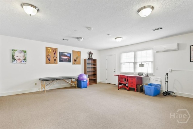 4715 Oakview Dr, Savannah, GA 31405 - recreation room featuring carpet floors, an AC wall unit, baseboards, and a textured ceiling