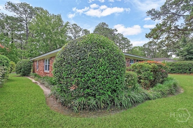 4715 Oakview Dr, Savannah, GA 31405 - view of property exterior featuring brick siding and a yard