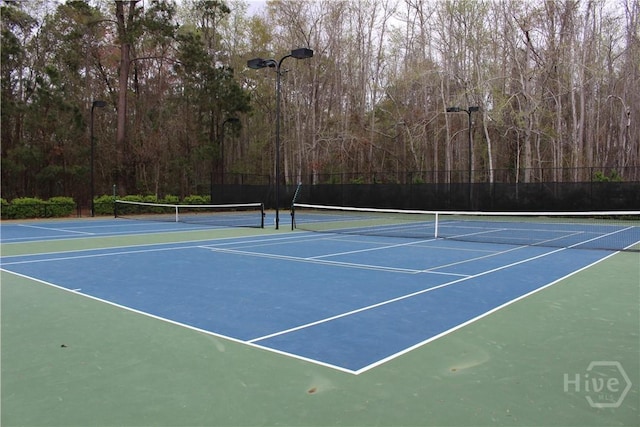 153 Como Dr, Pooler, GA 31322 - view of tennis court featuring community basketball court and a wooded view