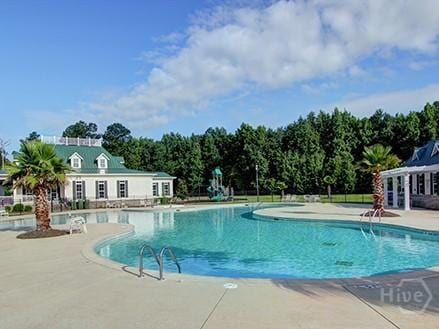 153 Como Dr, Pooler, GA 31322 - community pool featuring a patio