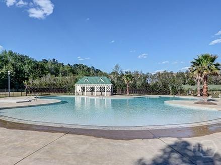 153 Como Dr, Pooler, GA 31322 - community pool featuring a patio area