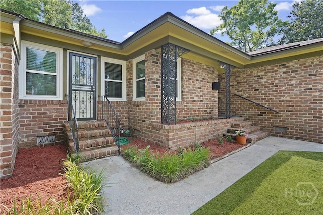 733 E Derenne Ave, Savannah, GA 31405 - doorway to property with brick siding and crawl space