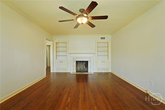 733 E Derenne Ave, Savannah, GA 31405 - unfurnished living room with built in features, a high end fireplace, ornamental molding, baseboards, and ceiling fan
