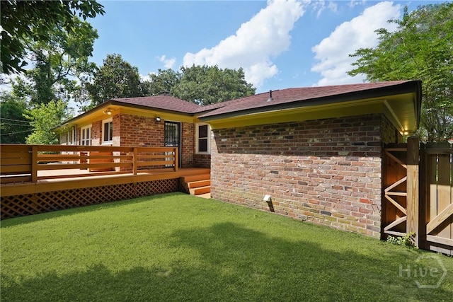 733 E Derenne Ave, Savannah, GA 31405 - back of house with brick siding, a yard, and a deck