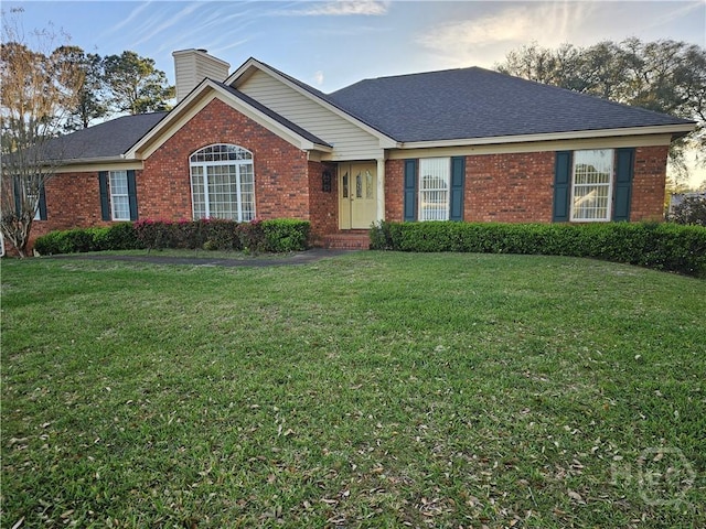 127 Lakeshore Dr, Savannah, GA 31419 - ranch-style home with brick siding, a chimney, and a front yard