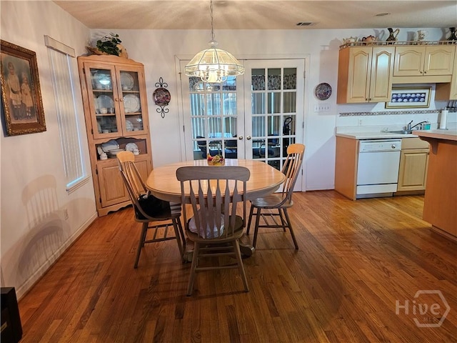 127 Lakeshore Dr, Savannah, GA 31419 - dining area with wood finished floors, a chandelier, and french doors