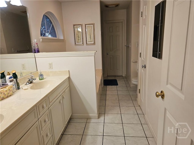 127 Lakeshore Dr, Savannah, GA 31419 - bathroom featuring double vanity, tile patterned floors, a bath, toilet, and baseboards