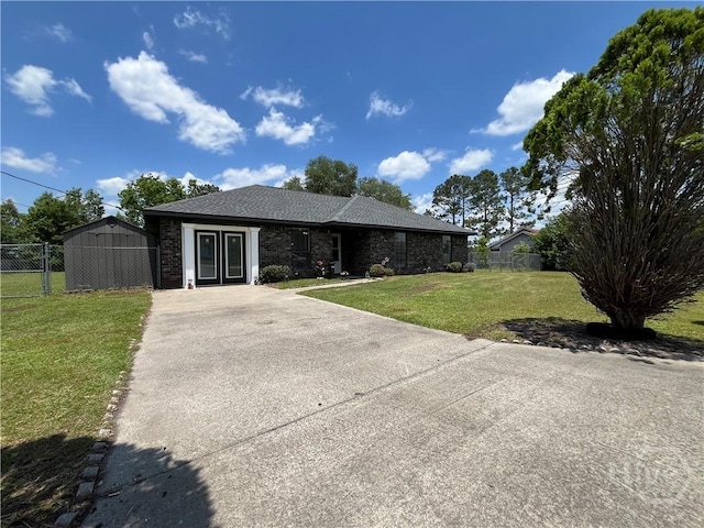 43 Fabian Ln, Hinesville, GA 31313 - ranch-style home with concrete driveway and a shingled roof