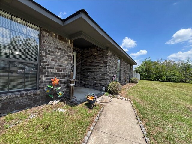 43 Fabian Ln, Hinesville, GA 31313 - view of grassy yard featuring a patio area