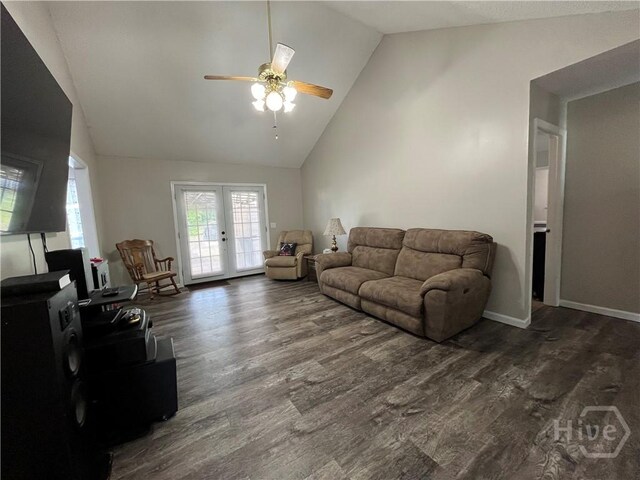 43 Fabian Ln, Hinesville, GA 31313 - living room with a ceiling fan, dark wood-style floors, high vaulted ceiling, french doors, and baseboards