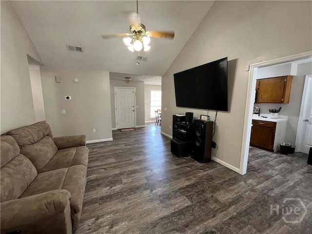 43 Fabian Ln, Hinesville, GA 31313 - living room with dark wood finished floors, a ceiling fan, baseboards, and high vaulted ceiling
