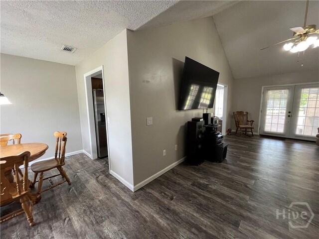 43 Fabian Ln, Hinesville, GA 31313 - dining room with dark wood-style flooring, a ceiling fan, baseboards, lofted ceiling, and a textured ceiling
