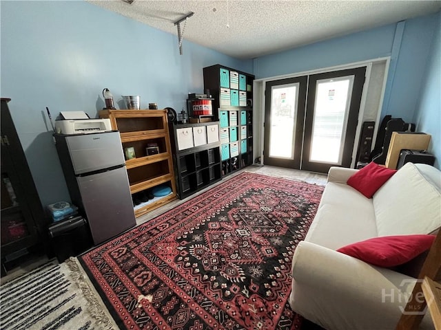 43 Fabian Ln, Hinesville, GA 31313 - living room with french doors and a textured ceiling