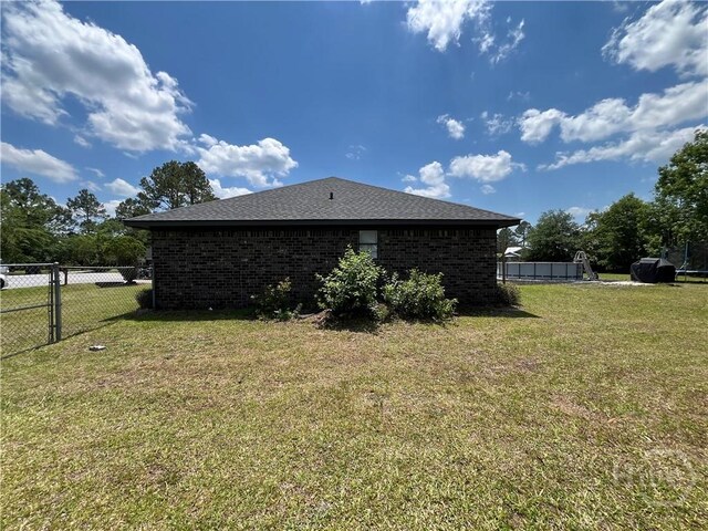 43 Fabian Ln, Hinesville, GA 31313 - view of home's exterior featuring brick siding