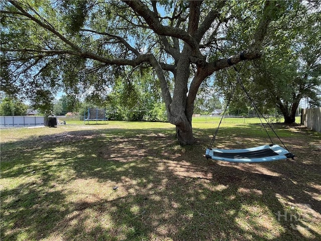 43 Fabian Ln, Hinesville, GA 31313 - view of yard with a trampoline