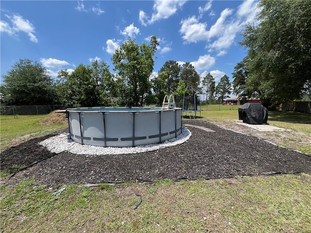 43 Fabian Ln, Hinesville, GA 31313 - view of yard with a trampoline