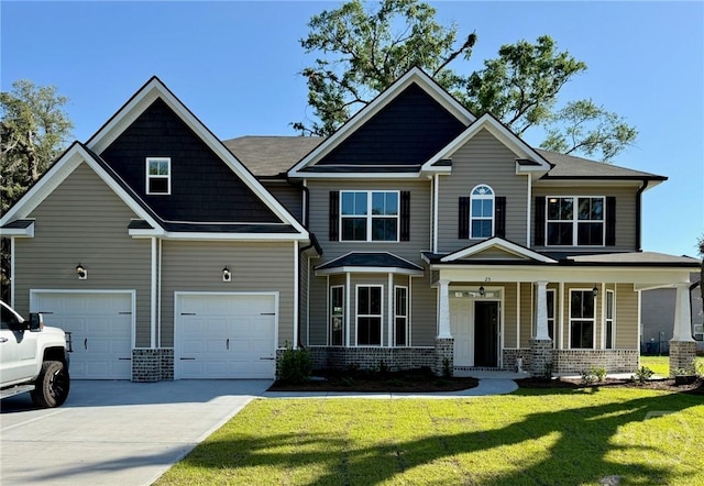 25 Oakmont Dr, Guyton, GA 31312 - craftsman house with driveway, a front lawn, an attached garage, brick siding, and a porch