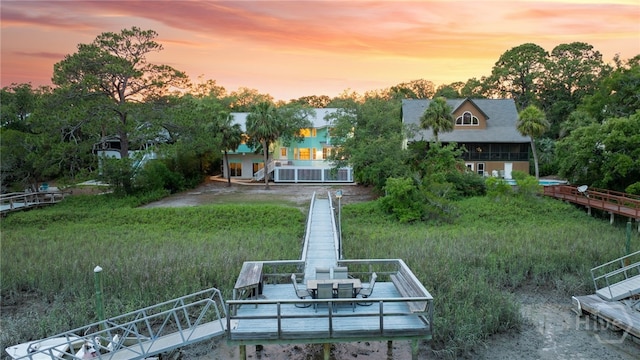 108 San Marco Dr, Tybee Island, GA 31328 - back of house at dusk with stairs
