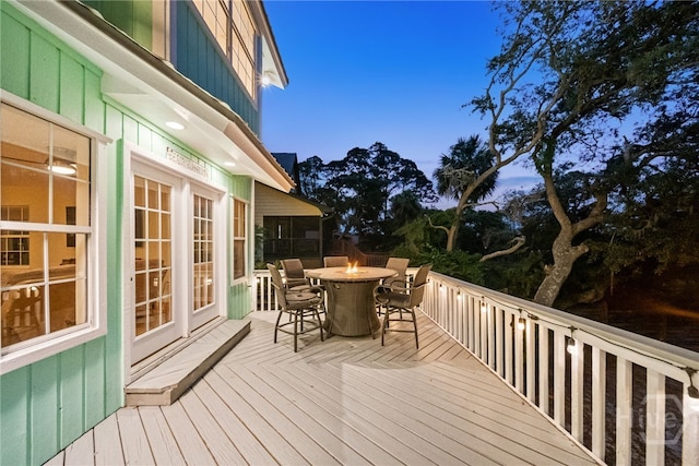 108 San Marco Dr, Tybee Island, GA 31328 - wooden terrace featuring outdoor dining space and a fire pit