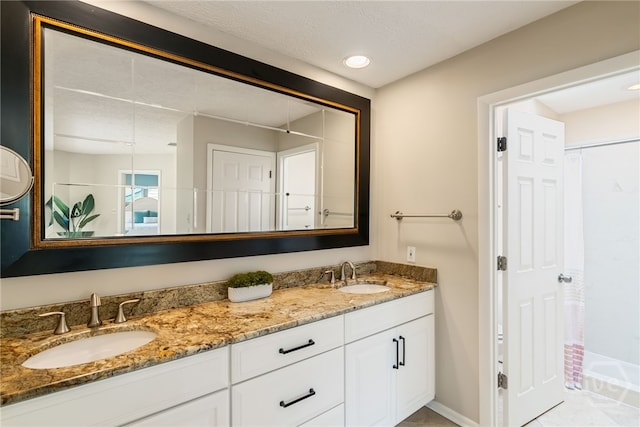 108 San Marco Dr, Tybee Island, GA 31328 - bathroom with double vanity, baseboards, and recessed lighting