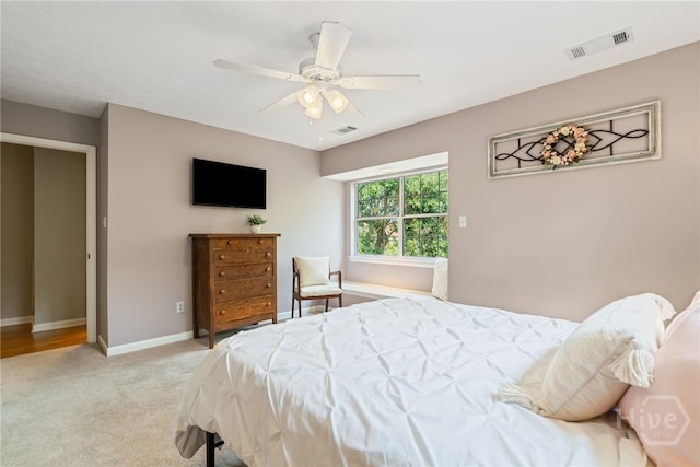 108 San Marco Dr, Tybee Island, GA 31328 - bedroom featuring light carpet, baseboards, and a ceiling fan