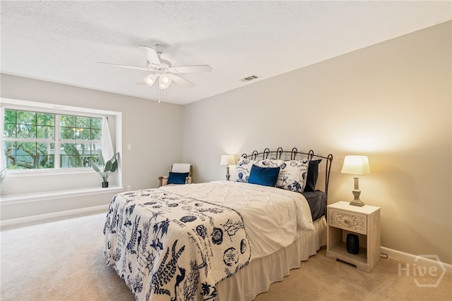 108 San Marco Dr, Tybee Island, GA 31328 - bedroom with light carpet, baseboards, and ceiling fan