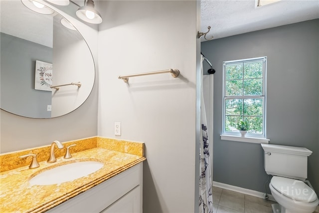 108 San Marco Dr, Tybee Island, GA 31328 - full bath featuring vanity, tile patterned floors, toilet, curtained shower, and a textured ceiling