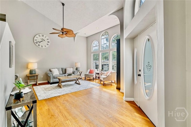 108 San Marco Dr, Tybee Island, GA 31328 - entrance foyer featuring high vaulted ceiling, ceiling fan, light wood-style flooring, and baseboards