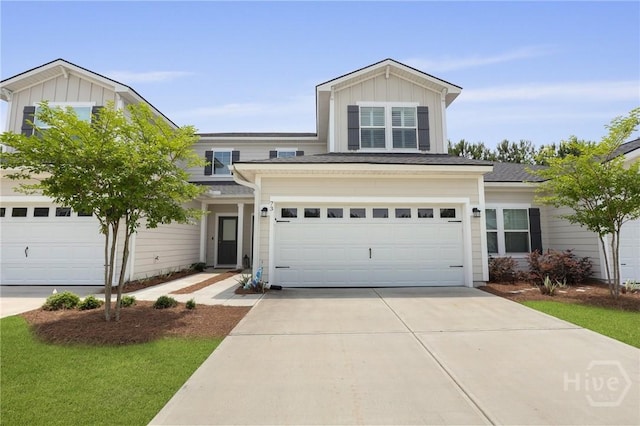 73 Small Pine Ln, Richmond Hill, GA 31324 - traditional home with concrete driveway, board and batten siding, and a garage