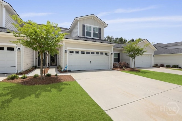 73 Small Pine Ln, Richmond Hill, GA 31324 - traditional home with board and batten siding, a front lawn, concrete driveway, and an attached garage
